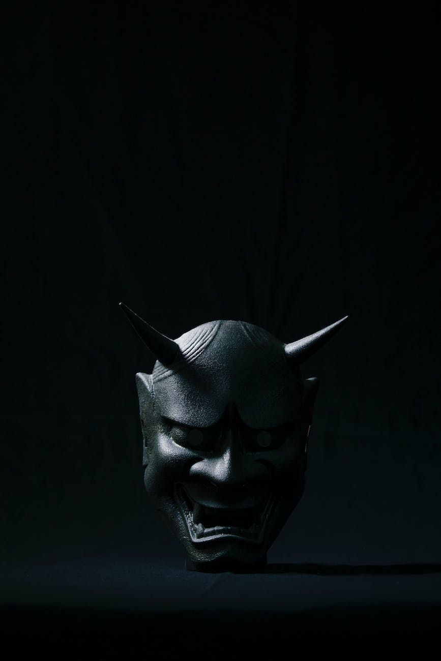 hannya mask on a black surface